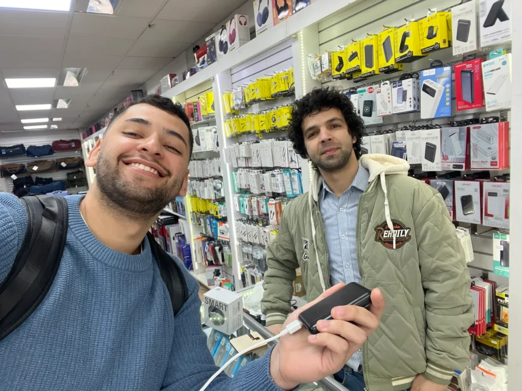 Technician repairing cracked iPhone screen in London