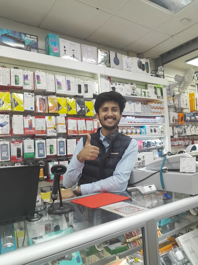 Technicians repairing iPhone, Samsung, and iPad devices in London