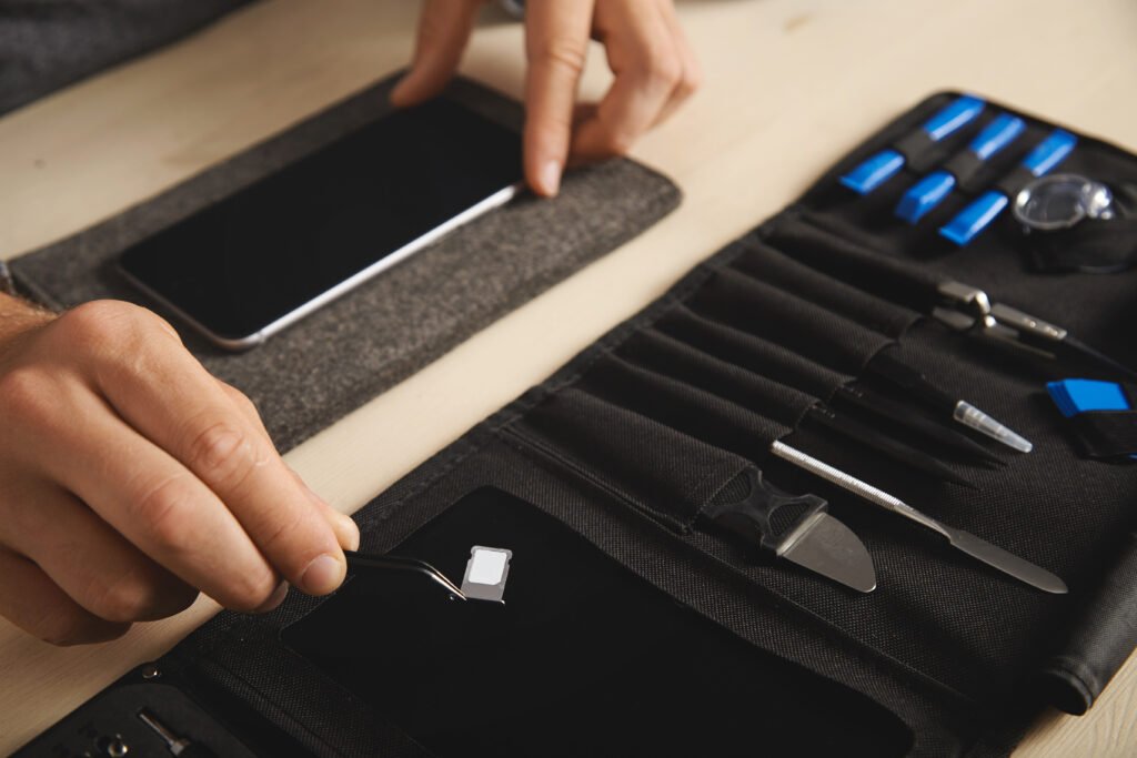 Technicians repairing an iPhone screen in London